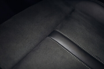 Close up view of modern car leather seat at the luxury interior
