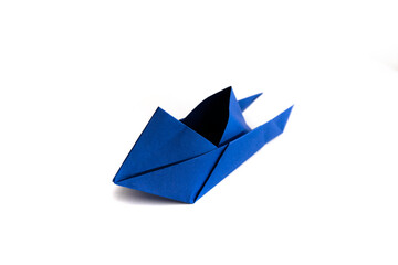 boat made of origami paper on a white background. origami.