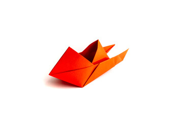 boat made of origami paper on a white background. origami.
