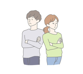 腕を組みそっぽを向いた険悪な雰囲気の若い男女、夫婦
