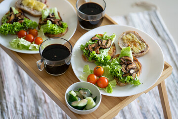 Healthy western breakfast, Sandwich on sourdough bread with cheese, mushroom and vegetable. Picnic breakfast
