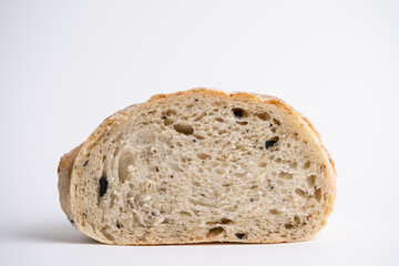 Olive sourdough bread cross section view with isolated white background.