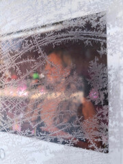 Window of a restaurant covered in frost