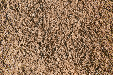 Natural brown soil, soil texture. Dirt road close-up.