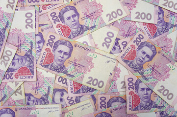 Fototapeta na wymiar Ukrainian money background. banknotes with a face value of 200 hryvnia money background. Ukrainian money. Business concept. Background with hryvnia.