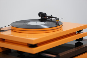 Hi fi turntable plays vinyl record with classic music. High fidelity records player in close up