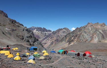Base camp tents mountains slopes, climbing route to mount Aconcagua. Parque provincial Aconcagua,...