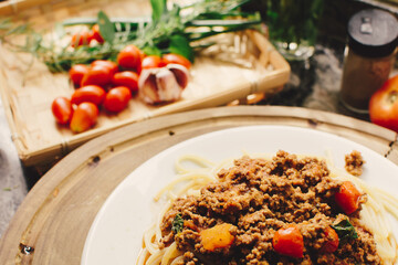 Bolognese pasta dish on a plate, photo in a kitchen