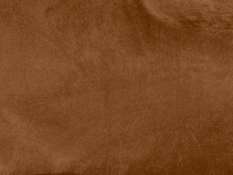 Brown color velvet fabric texture used as background. Empty brown fabric background of soft and smooth textile material. There is space for text...
