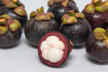 Queen of fruit. Mangosteens on the white background.
