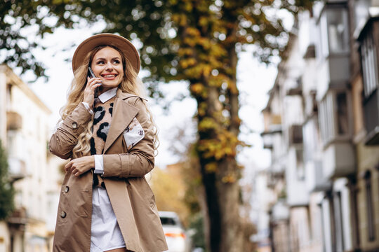Portrait of beautiful woman talking on the phone