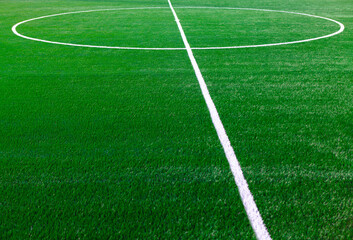 Obraz premium Football field marking in the center . Green grass of soccer field