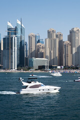 Naklejka na ściany i meble Luxury white yacht sailing at Persian Gulf, Dubai, United Arab Emirates. 