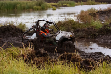 athlete on a ssv rides in the mud © Елена Вырыпаева