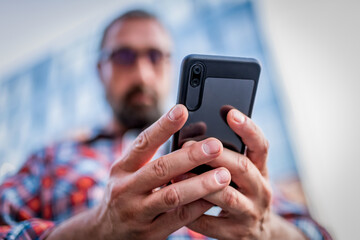 Handsome Businessman in the Street with Mobile Phone