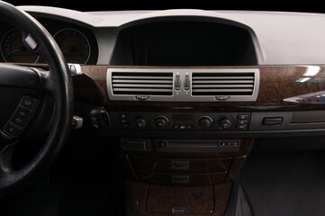Obraz na płótnie Canvas Classic prestige car inside. Multimedia screen and control buttons.