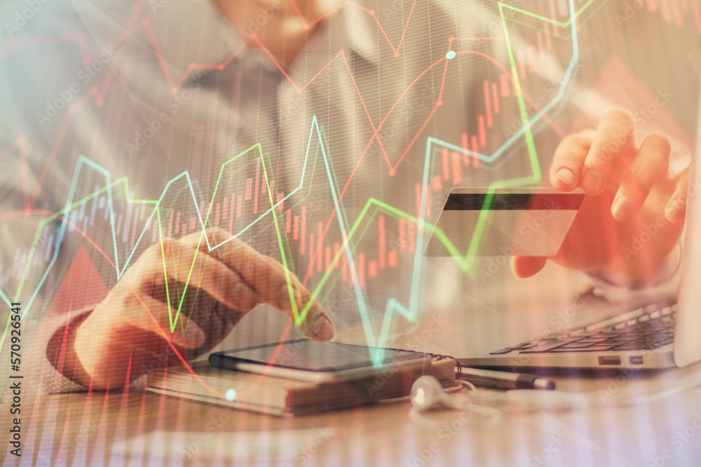 Poster double exposure of man hands holding a credit card and forex graph drawing. stock trading and digita