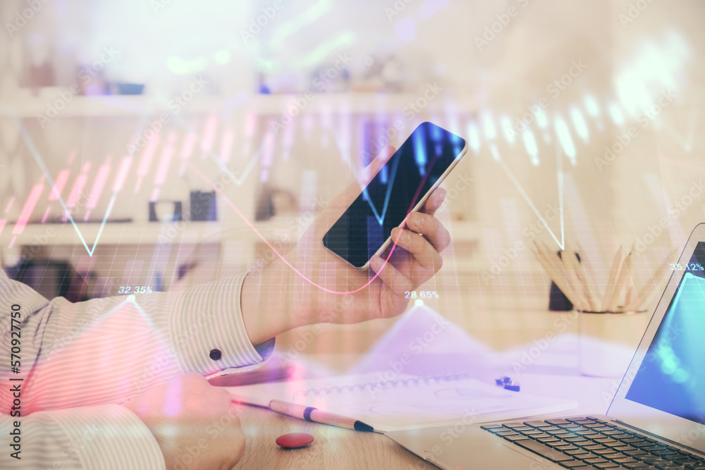 Poster double exposure of man's hands holding and using a digital device and forex graph drawing. financial