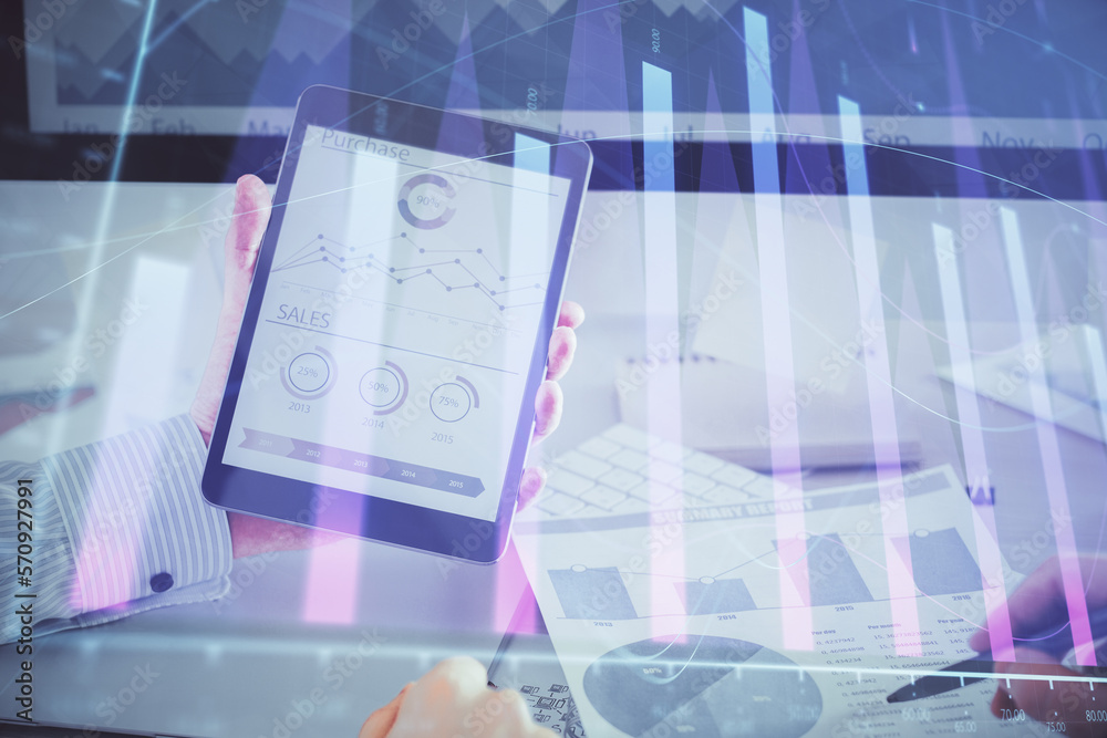 Poster double exposure of man's hands holding and using a digital device and forex graph drawing. financial