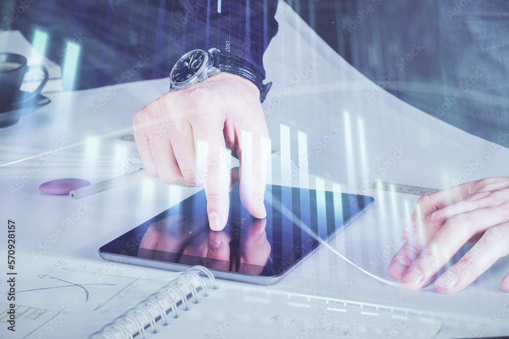 Poster Double exposure of man's hands holding and using a digital device and forex graph drawing. Financial market concept.