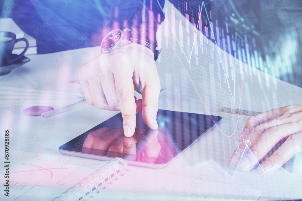 Poster double exposure of man's hands holding and using a digital device and forex graph drawing. financial