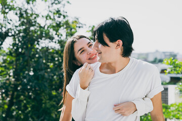 Fototapeta premium Couple in love young men and women hugging Have fun talking and laughing.