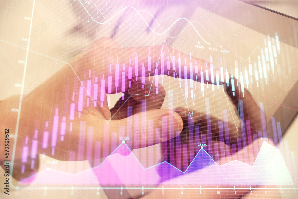 Poster multi exposure of man's hands holding and using a phone and financial chart drawing. market analysis