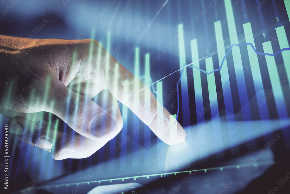 Poster multi exposure of man's hands holding and using a phone and financial chart drawing. market analysis