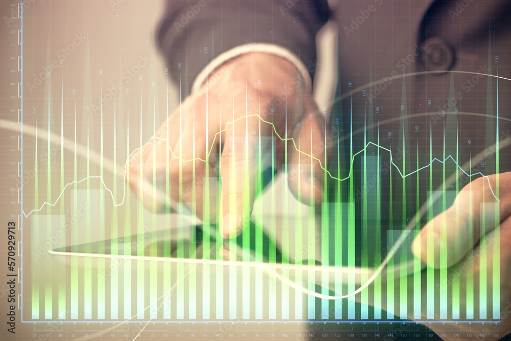 Poster multi exposure of man's hands holding and using a phone and financial chart drawing. market analysis