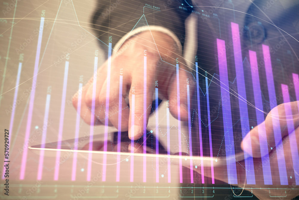 Poster multi exposure of man's hands holding and using a phone and financial chart drawing. market analysis