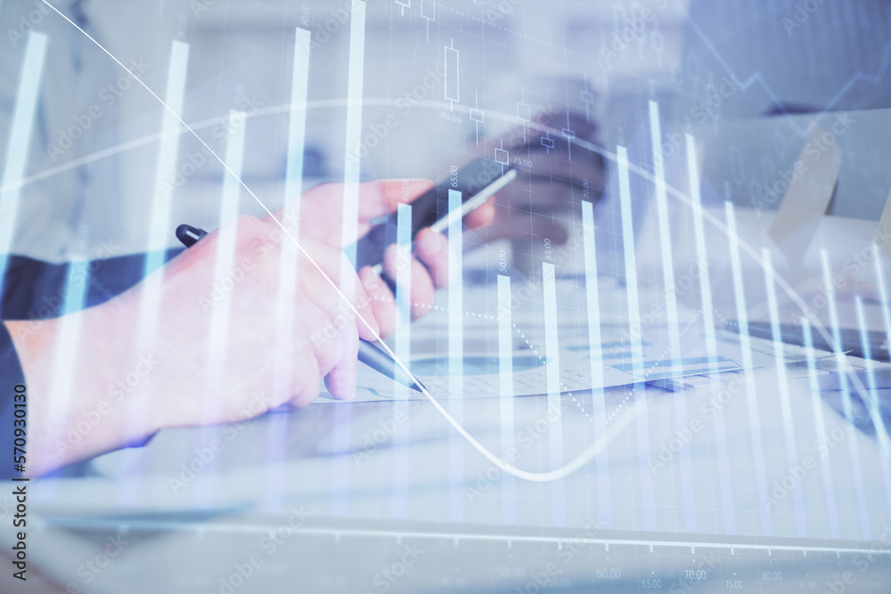 Aufkleber double exposure of man's hands holding and using a phone and financial chart drawing. market analysi