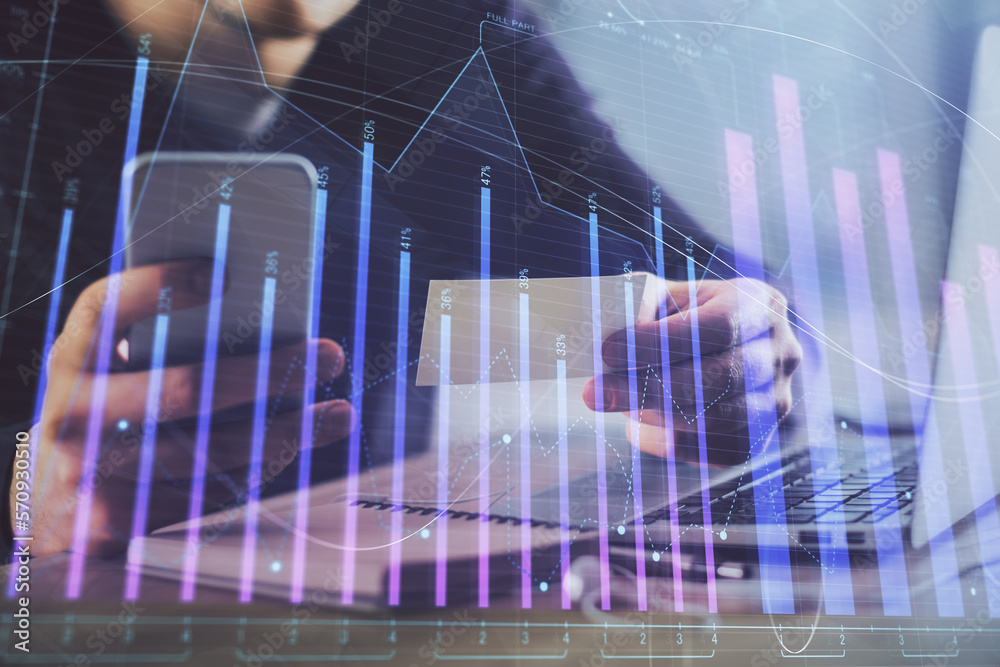 Poster double exposure of man's hands holding and using a phone and financial graph drawing. analysis conce
