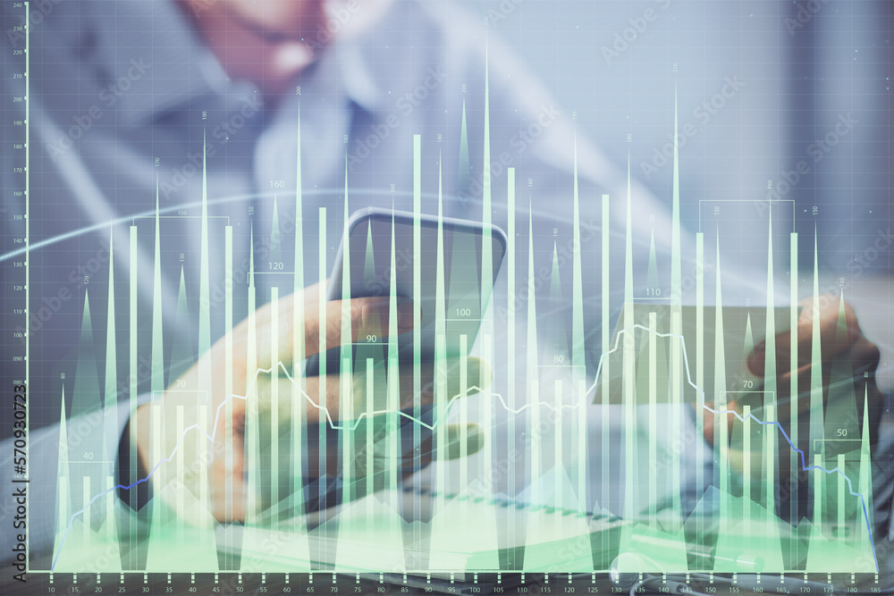 Poster double exposure of man's hands holding and using a phone and financial graph drawing. analysis conce