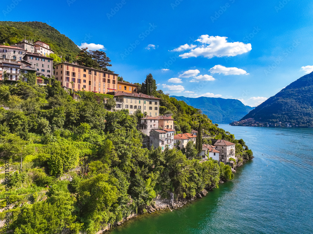 Wall mural Aerial view of Nesso, a picturesque and colourful village sitting on the banks of Lake Como, Italy