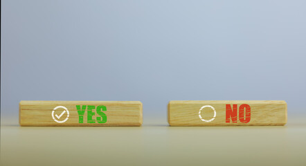 wooden block yes or no symbol and checkmark  Alternative concepts, decision making, and true and false test questions.
