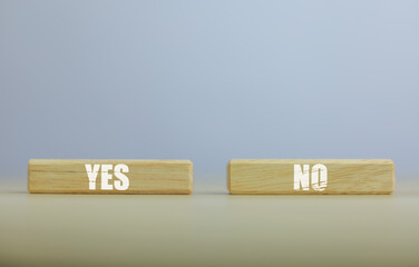 wooden block yes or no symbol and checkmark  Alternative concepts, decision making, and true and false test questions.