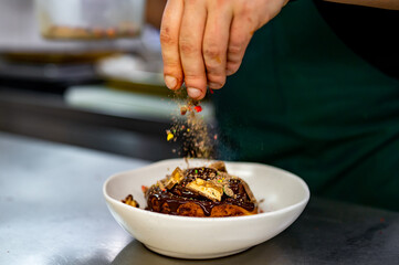 chef cooking dessert in the kitchen