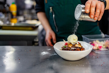 chef cooking dessert in the kitchen