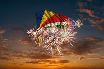 Flag of Seychelles and Holiday fireworks in sky