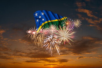 Flag of Solomon Islands and Holiday fireworks in sky