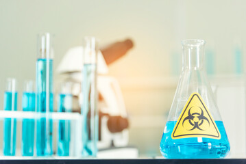 Biohazard disease alert corona outbreak sign on glass wall laboratory science center. Medical care clinic with hazard alert sign. Medical Healthcare concept.