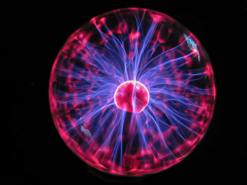 Plasma ball with many beams emanating from the purple core	
