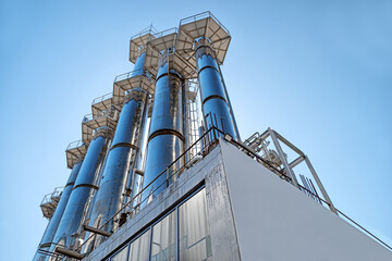 Industrial metal turbine against the background of the blue sky © izikmd
