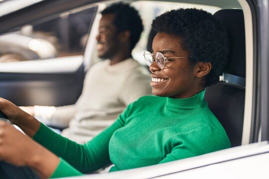 African American Man And Woman Couple Driving Car At Street