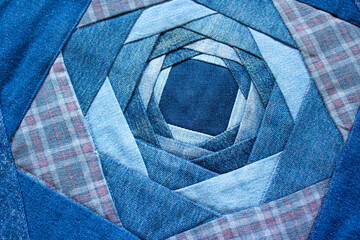 Jeans background, patchwork texture, patchwork fabric pattern. The new life of old jeans. Recycling...