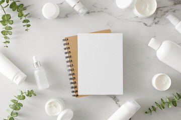 Skincare products concept. Flat lay photo of white cosmetic tubes, cream jars, serum dropper...