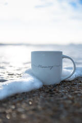 cup of coffee on the beach