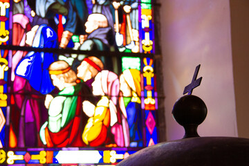 Fototapeta premium Sacred Light – Cross and Stained Glass Reflection
