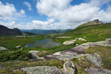 Russia. Krasnoyarsk Territory, Eastern Sayans. A small glacial lake on the high mountain passes of the natural mountain park Ergaki, located at an altitude of 1650m above sea level.
