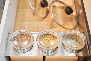Pantry food cabinet. Kitchen storage organization. Pasta, grains in glass jars. Organic food. Home cooking. Nutrition food. Glass containers. Food preparation. Zero waste, plastic free. 